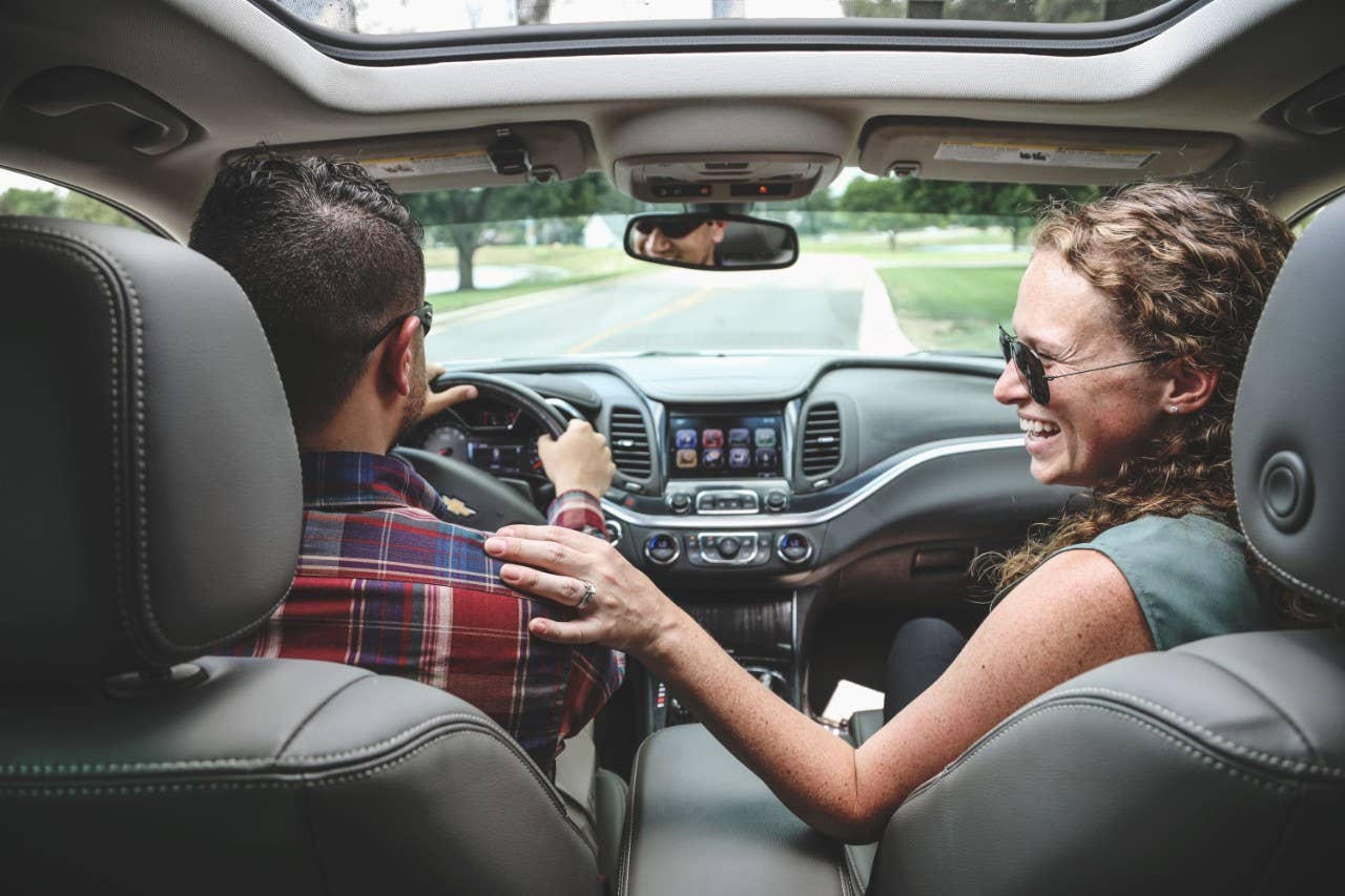 Couple driving in car