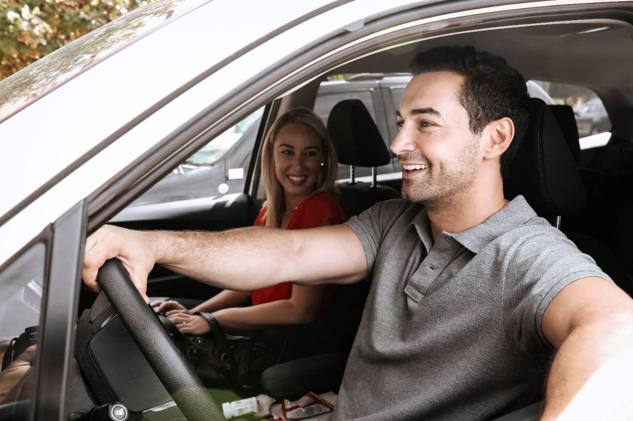 Couple driving car